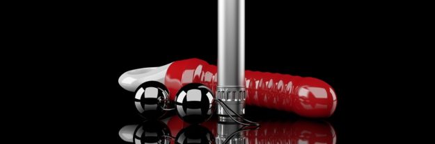 sex toys on black background